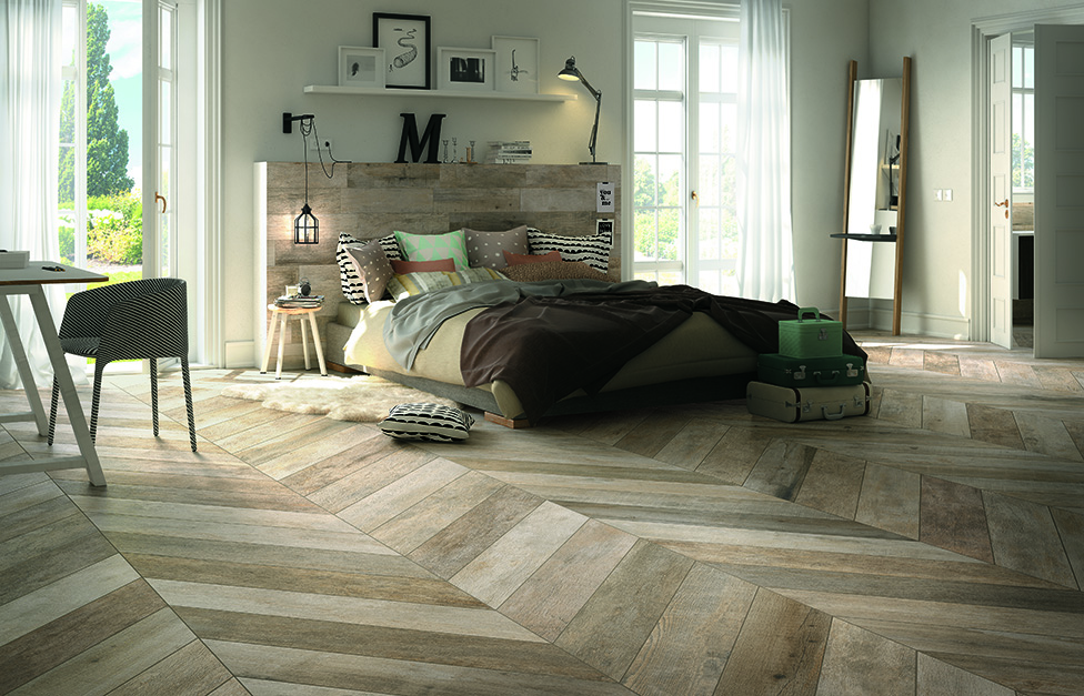 Chambre de style champêtre avec un beau parquet pour une ambiance nature et chaleureuse.